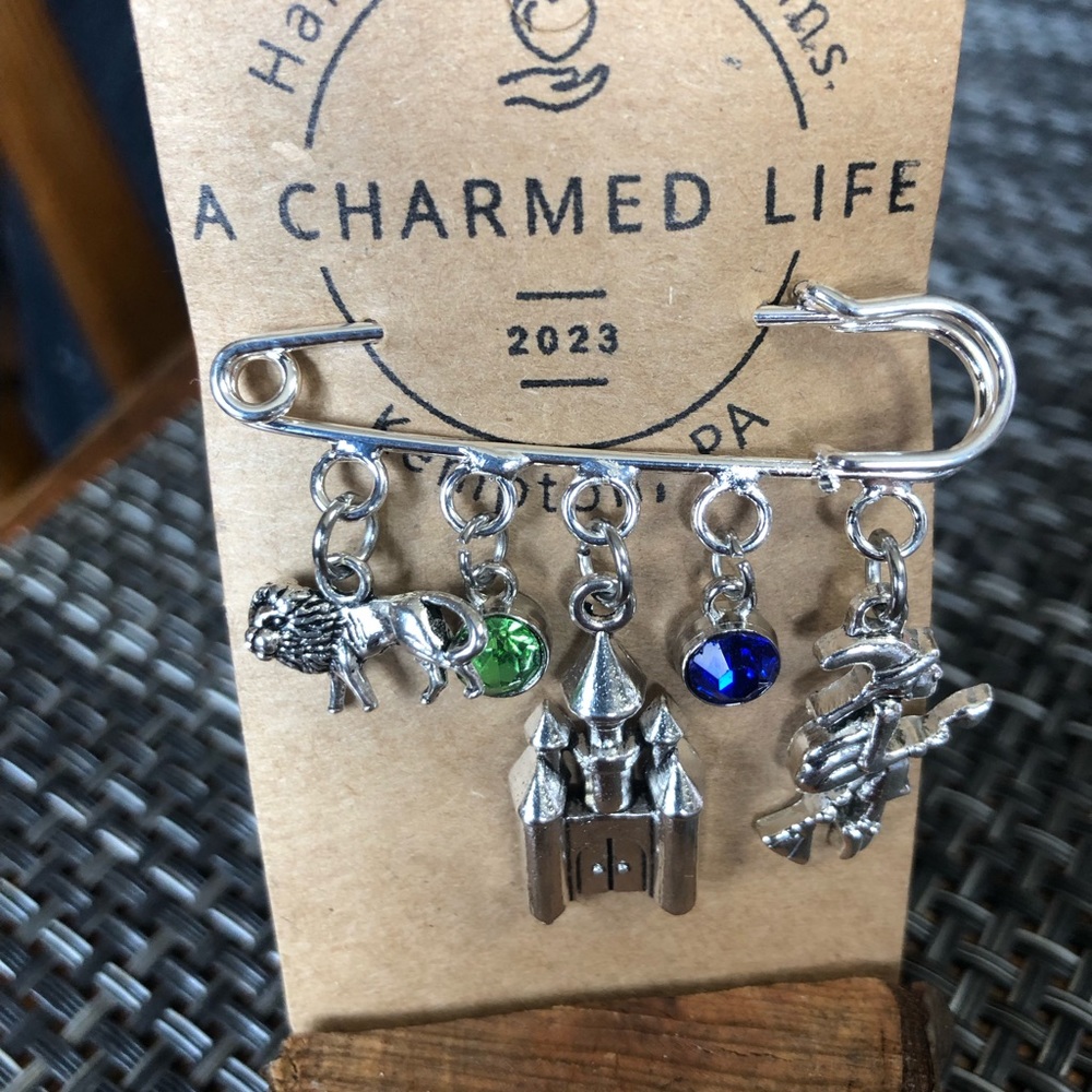 NWT, Handmade by A Charmed Life. Wizard of Oz Themed Charms on a Silver Pin